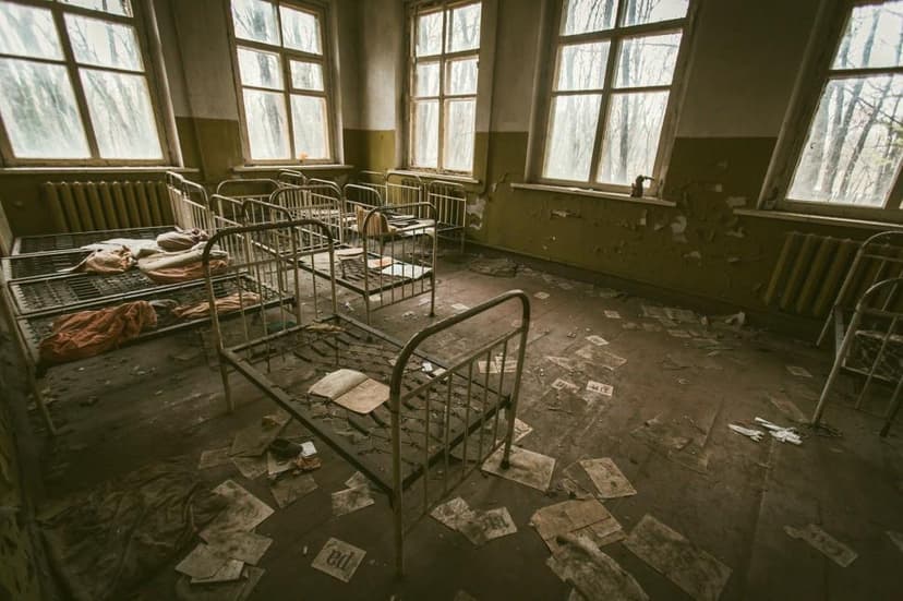 Abandoned hospital room with numerous windows